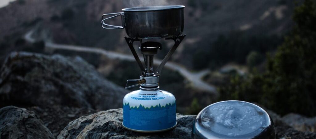 lightweight camping stove with pan on the boil